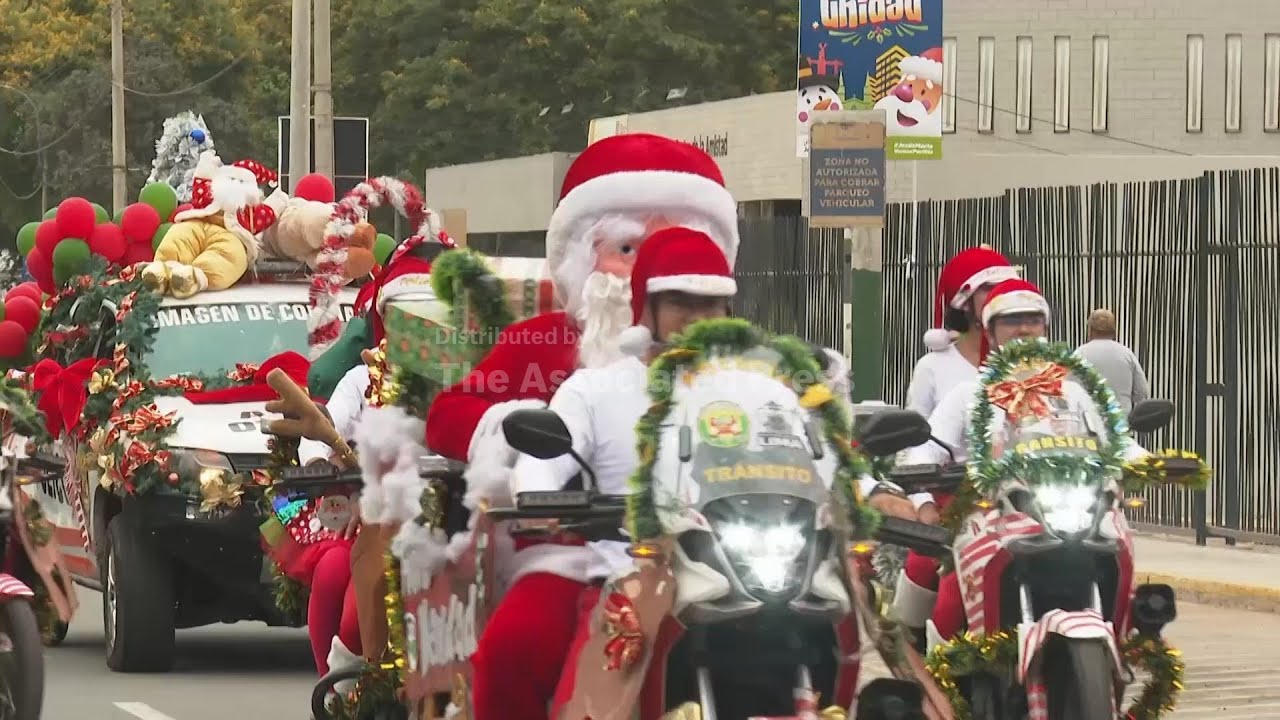 Peru's National Police drive the streets of Lima in costume for Christmas Eve parade