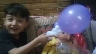 beautiful baby boy playing with balloon