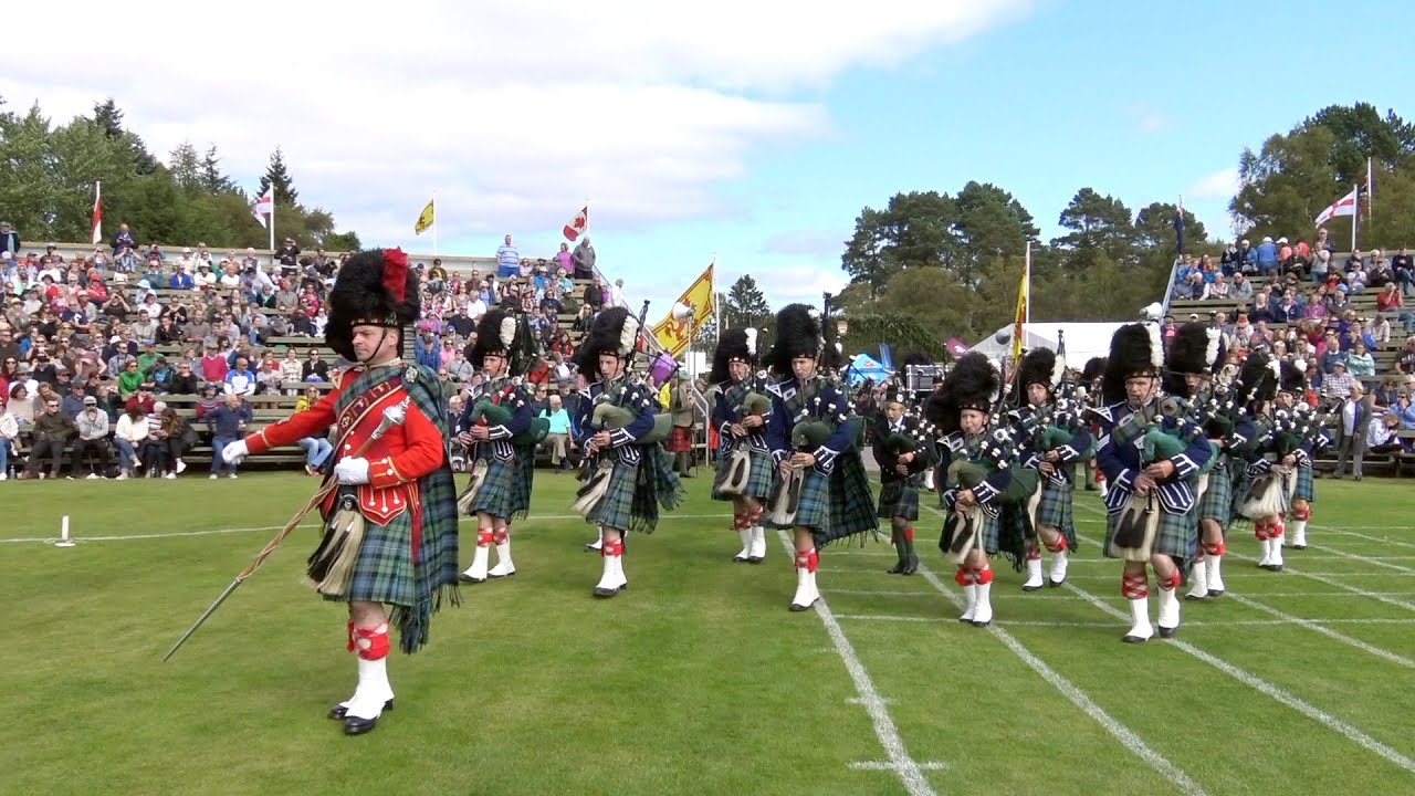 J K Cairns set as Drum Major Ian Esson leads Ballater Pipe Band into