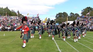 J K Cairns Set As Drum Major Ian Esson Leads Ballater Pipe Band Into The Braemar Gathering Site