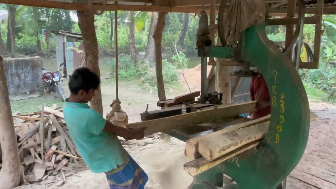 Wood is processed at a wooden architectural factory 