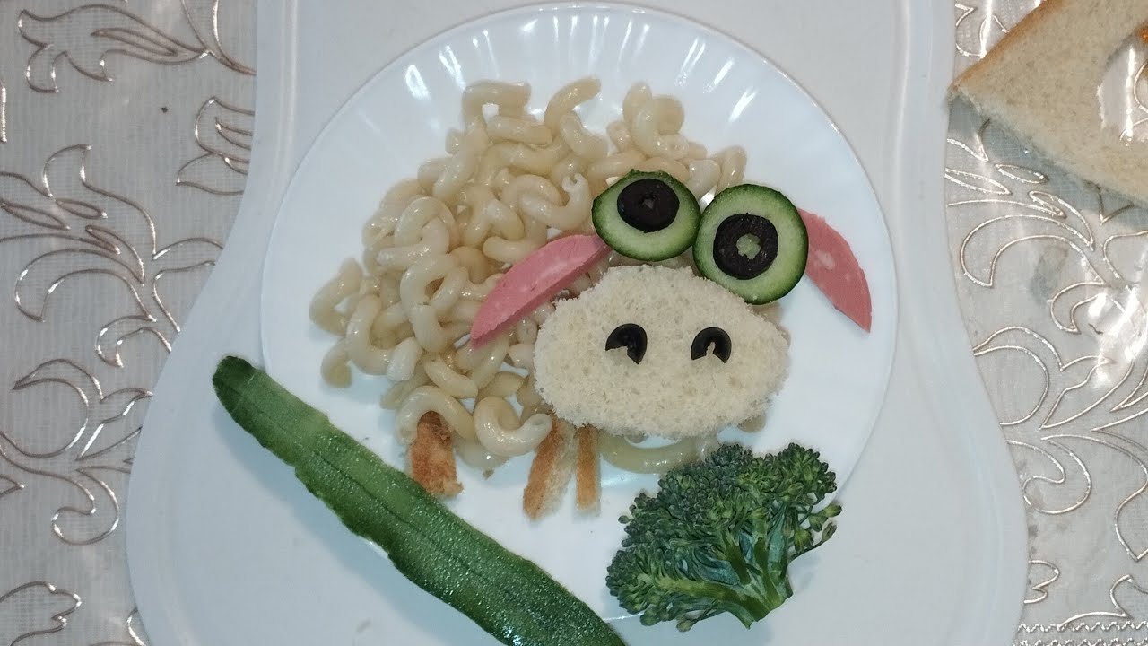 Make an image of a wonderful lamb from pasta, kalbasa and cucumbers.