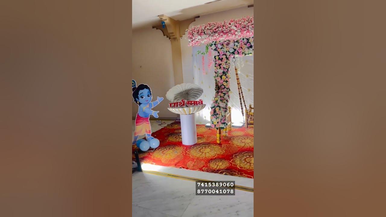 naming-ceremony-decoration-ideas-jhula-artificial-flowers-decoration