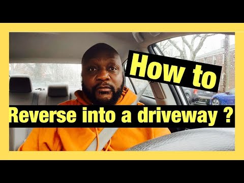 Car reversing out of a driveway