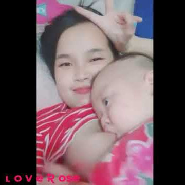 Beautiful mother breastfeeding 2022