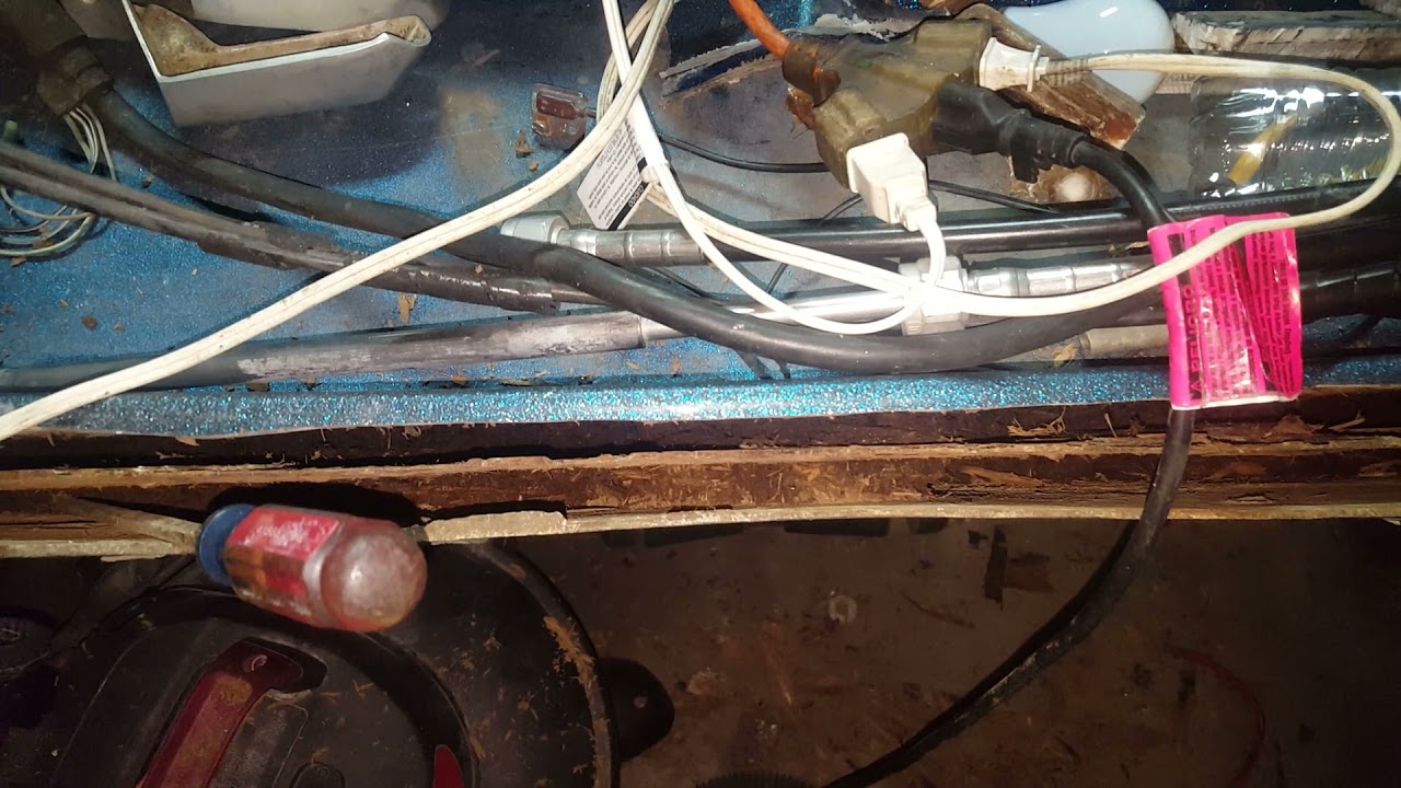 digging out the rotten transom wood