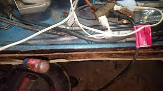 digging out the rotten transom wood