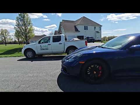 Porsche 718 drive away from us