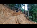 Constructing roads in treacherous mountain terrain bulldozer operators navigate risky narrow passes