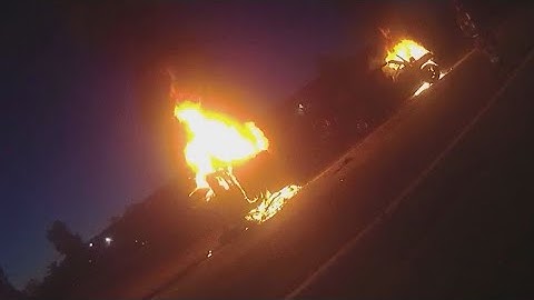 Video shows LMPD officers save drivers from fiery I-65 crash