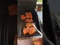 Cooking flavoured chicken thigh Fillet in a barbecue 