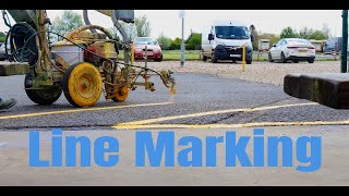 line marking a car park with the Graco 5900 and Titan 6955 line striping machines