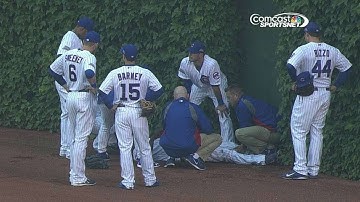 WSH@CHC: Lake slides into outfield wall, exits game