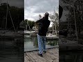 Pulling in a nice Northern Pike at the marina dock in the fall.