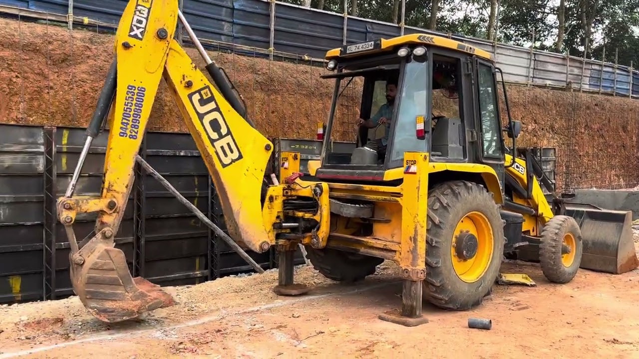 Jcb 3dx digging soil for placing supporting members for concrete 
