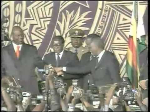 Zimbabwe's President Signs Historic Deal