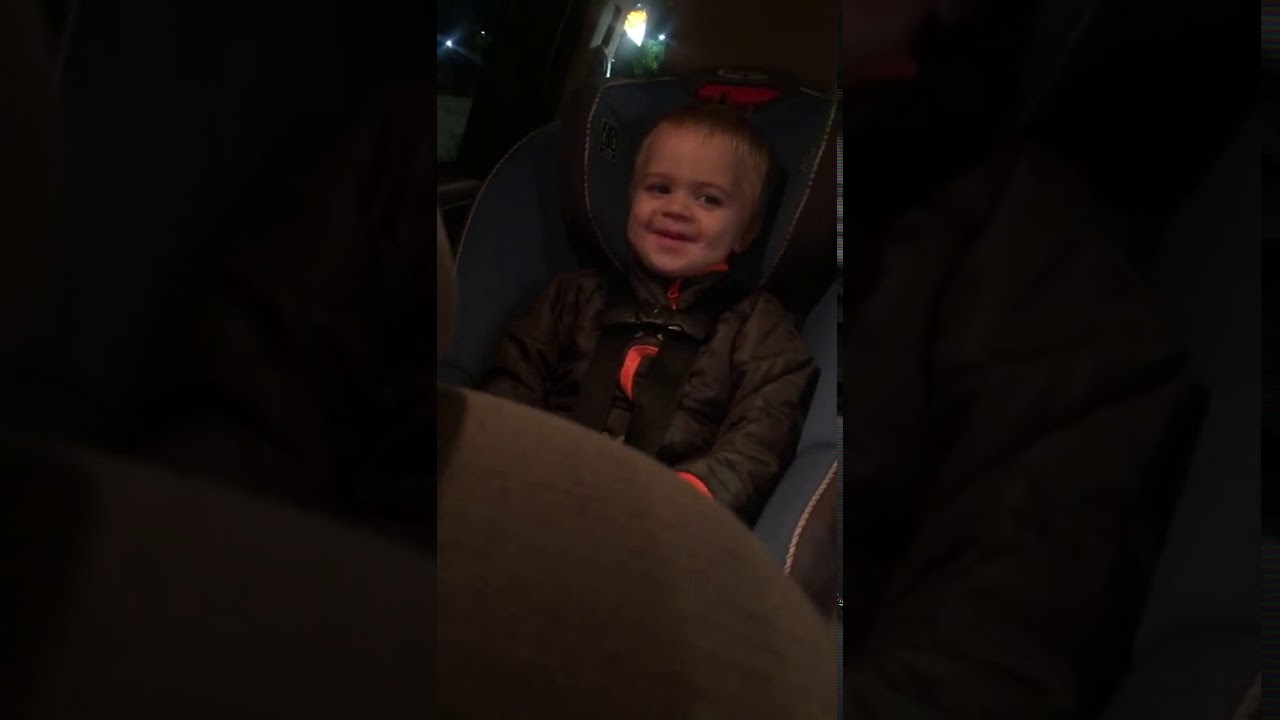 Sleepy toddler tries so hard to stay awake in the drive thru for ice cream.