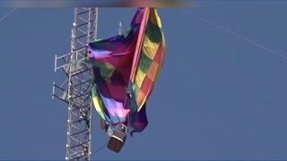 Dramatic rescue of two people in hot air balloon stuck in cell tower