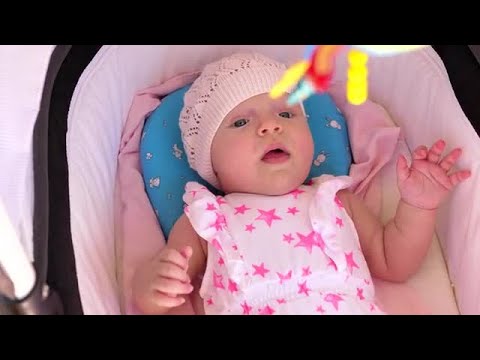 Baby Girl Lying In Pram Stock Video