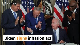 Biden signs inflation act as Dems plan ad blitz