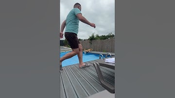 Dog Jumps On Pool Cover, Man Rushes To Rescue