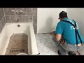 Installing Grecian Marble Peel and Stick Vinyl groutable tile in the bathroom