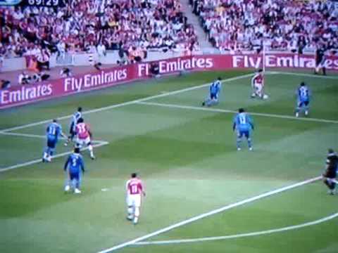Arsenal striker Nicklas Bendtner lands on Chelsea Midfielder Michael Essien after he scores a goal.
