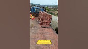 How to unload red bricks with the help of an excavator