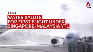 Singapore-Malaysia vaccinated travel lane: Water cannon salute as SIA VTL flight lands in KL