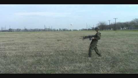Army soldier dual-wields some airsoft M249