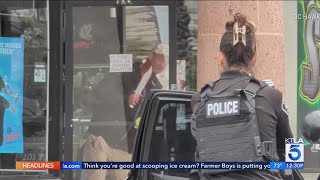 Suspect seen waving large knife in erratic standoff inside Fullerton smoke shop