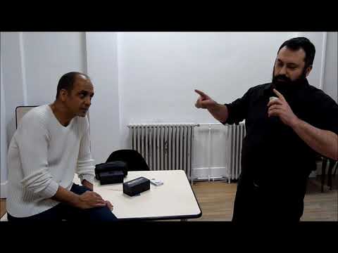 Showing a magic trick to Gregory Wilson