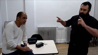 Showing a magic trick to Gregory Wilson