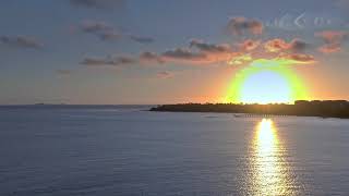 mixkit sunset behind the skyline on the beach over the sea 51445 hd ready