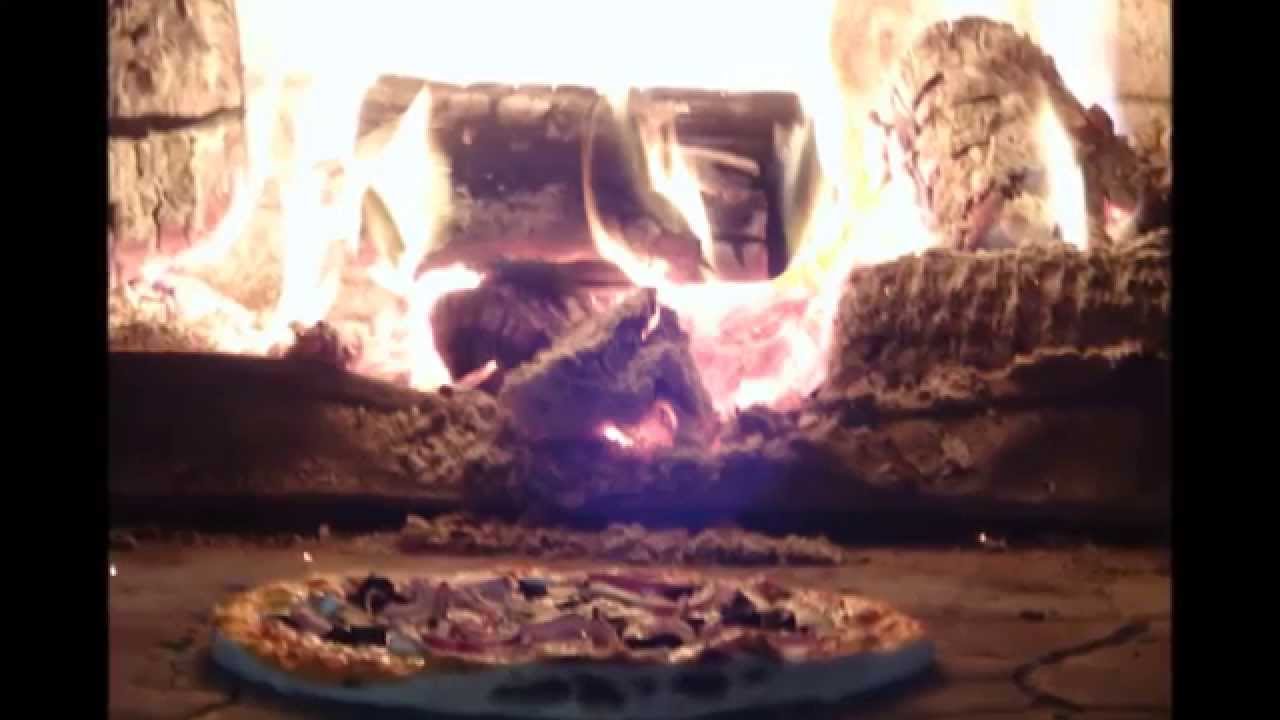 Buying a Pizza cooked in a Wood Fired Oven on Kilburn High Road