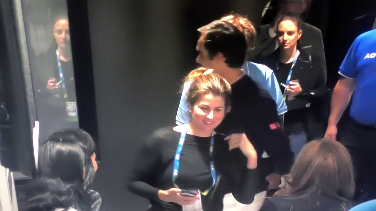 Mirka hugs Federer and takes a selfie together after the match against Millman