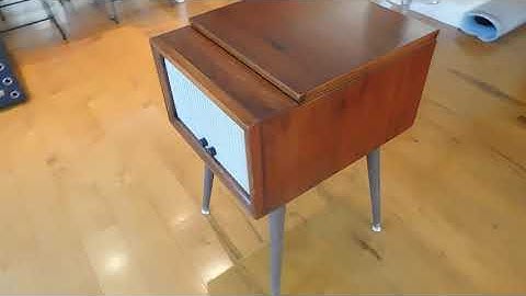 Magnavox record player consolette playing a couple 45 RPM records