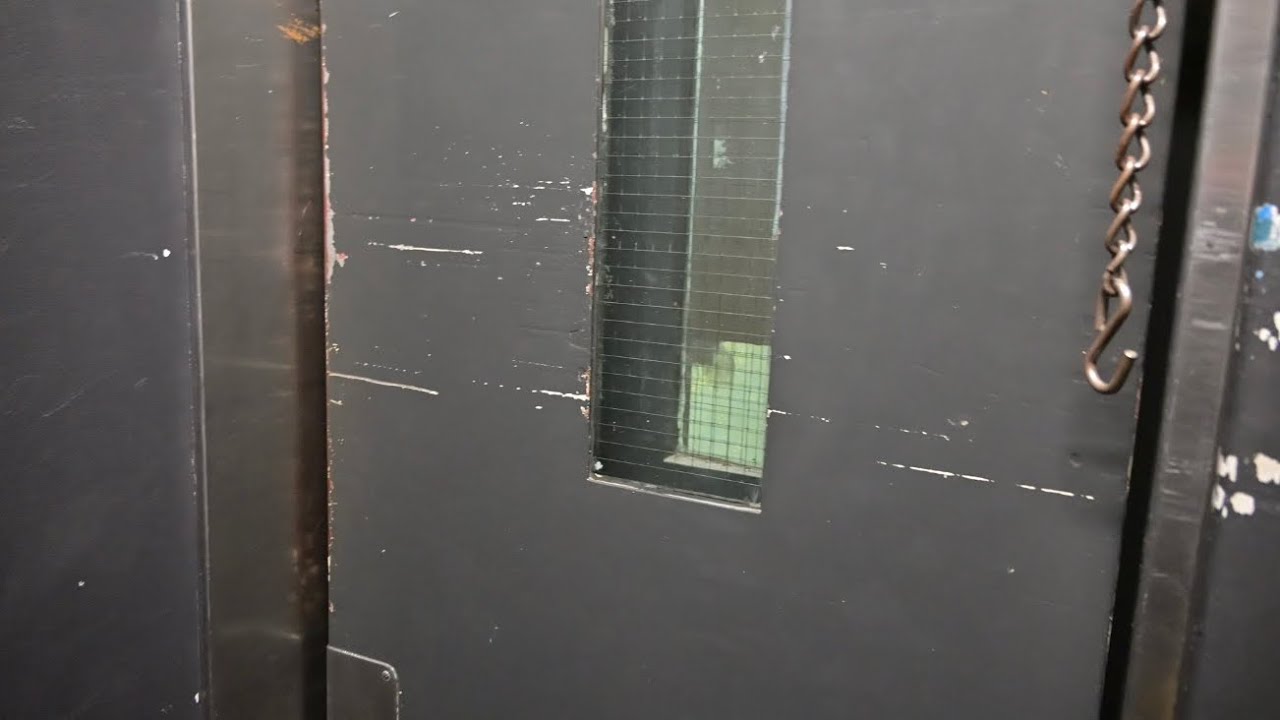 Fully original old Johns & Waygood traction elevator with manual doors in Adelaide, Australia