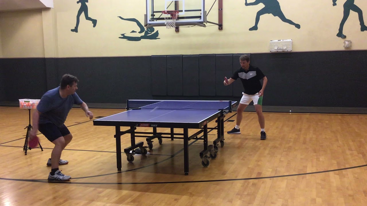 Coach Peter playing with 2003 world Champion Werner Schlager