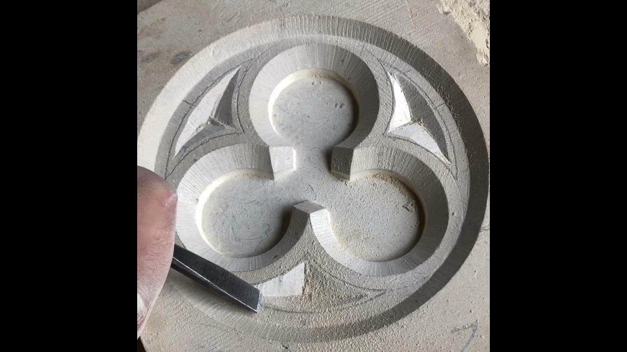 Working the dead eyes of the trefoil panel in Lincoln Cathedral limestone