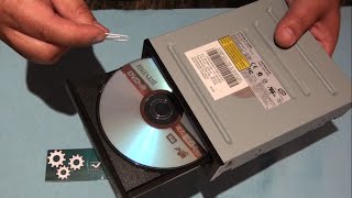 how to manually  open a dvd and a cd player with a paper clip without power