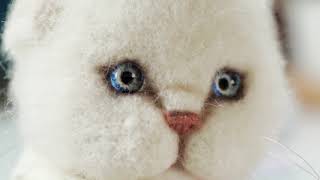 Soft toy kitten in the form of a white kitten, made of wool screenshot 3