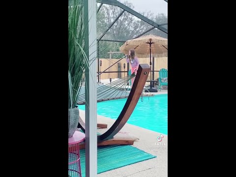 Florida girl caught singing 'Girl on Fire' while cleaning pool goes viral