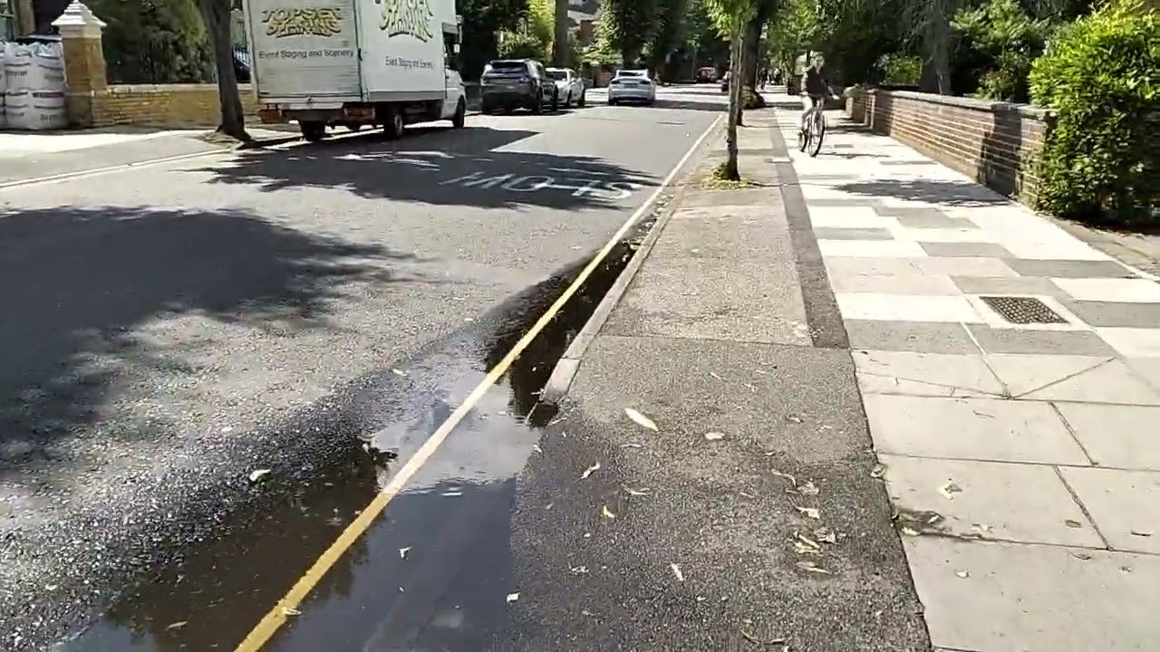 Puddles after heavy rain. Kew gardens road, Kew III, Richmond, UK, 05/07/23 