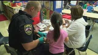 Canfield elementary students being provided with ID kits