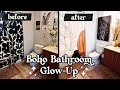 My apartment bathroom decor gets an earthy boho glow up 