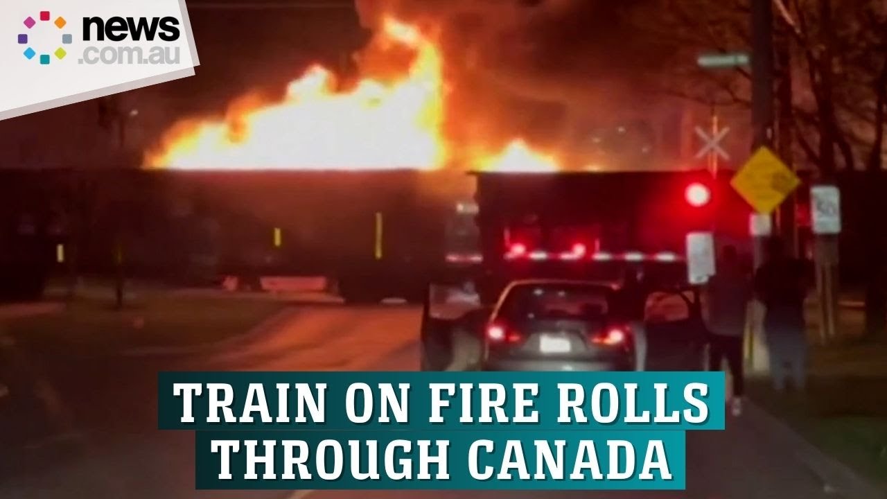 Train on fire rolls through city in Canada