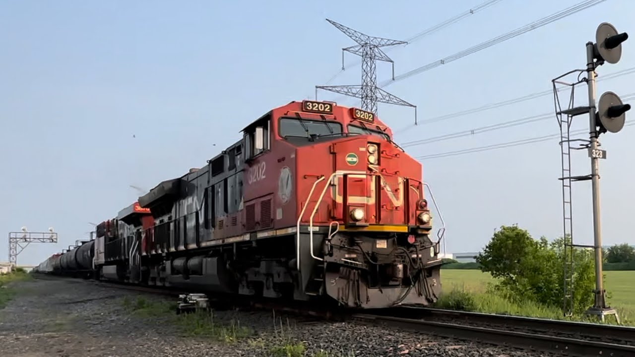 CN train M302 at Mansewood with an Ex-citirail DPU