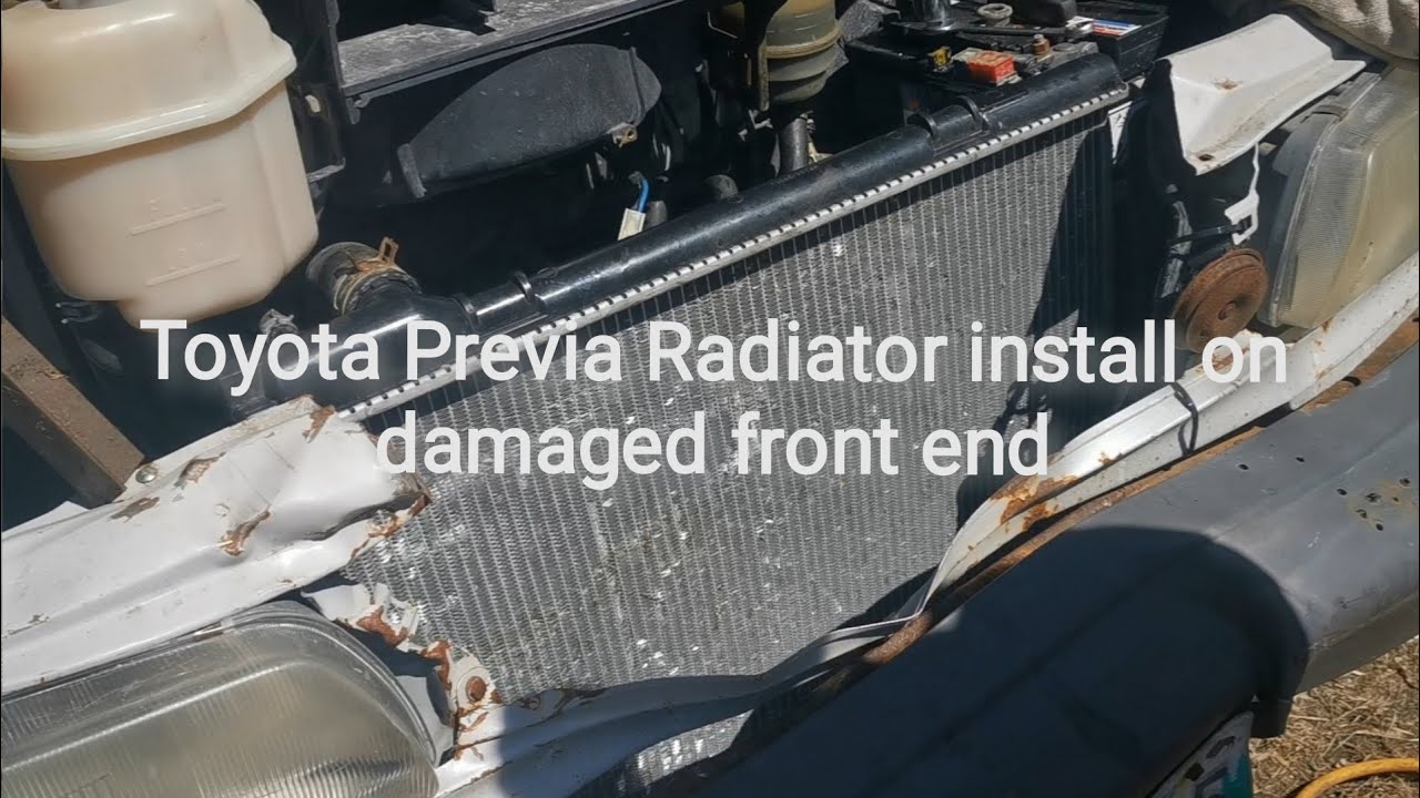 Toyota Previa Installing damaged radiator on damaged van - YouTube