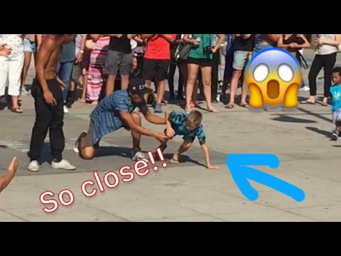 7 year old surprises street performers with a backflip